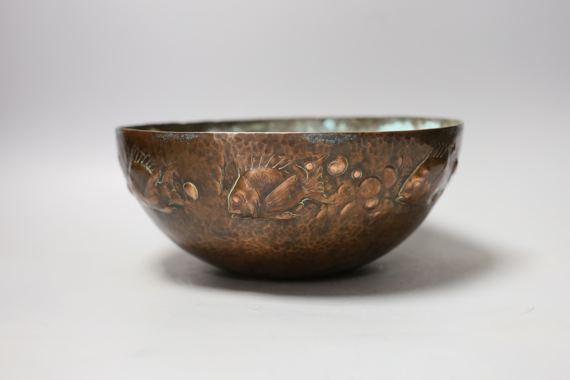 A Newlyn style planished copper ‘fish’ bowl, 24.5 cms diameter